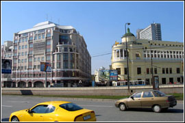View of the main building of the Multifunctional  Alfa-Arbat-Center Complex with underground parking and subway entrance hall from the Arbatskaia Square (at the left).